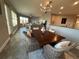 Open concept view of dining and living room area with natural light and comfortable seating at 3418 79Th Street W Cir # 202, Bradenton, FL 34209