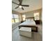 Spacious primary bedroom with neutral color scheme, comfortable bed, and a tranquil view at 3418 79Th Street W Cir # 202, Bradenton, FL 34209