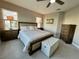 Spacious primary bedroom with neutral color scheme, comfortable bed, and natural light at 3418 79Th Street W Cir # 202, Bradenton, FL 34209