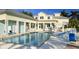 Outdoor swimming pool with lounge chairs and manicured landscaping at 3418 79Th Street W Cir # 202, Bradenton, FL 34209