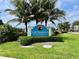 Community sign at The Preserve At Palma Sola Bay Club surrounded by lush landscaping at 3418 79Th Street W Cir # 202, Bradenton, FL 34209