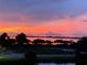 Beautiful sunset view overlooking a body of water and lush green landscape at 3418 79Th Street W Cir # 202, Bradenton, FL 34209