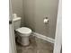 Clean, well-lit half bathroom with a standard toilet and basic amenities at 3418 79Th Street W Cir # 202, Bradenton, FL 34209
