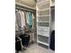 Well-organized walk-in closet with clothes racks, shelves, drawers, and a wire basket at 3418 79Th Street W Cir # 202, Bradenton, FL 34209