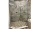 Detailed view of the walk-in shower featuring stylish tile work and dual shower heads at 3418 79Th Street W Cir # 202, Bradenton, FL 34209