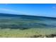 Clear water view showcasing serene shoreline and distant landscape at 3418 79Th Street W Cir # 202, Bradenton, FL 34209
