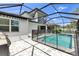 Fenced pool with brick pavers and a view of the two-story home at 3553 Secluded Ct, Sarasota, FL 34240