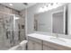 Bathroom features a glass shower, modern vanity, and patterned tile at 3553 Secluded Ct, Sarasota, FL 34240