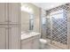 Bathroom features a shower, modern vanity, and decorative tile at 3553 Secluded Ct, Sarasota, FL 34240
