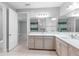 Bathroom with dual sinks, quartz countertop, and walk-in glass shower at 3553 Secluded Ct, Sarasota, FL 34240