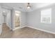 Bedroom with window with blinds and hardwood floors at 3553 Secluded Ct, Sarasota, FL 34240