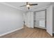Bedroom with ceiling fan, closet, and hardwood floors at 3553 Secluded Ct, Sarasota, FL 34240