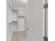 Walk-in closet with custom shelving and ample storage space at 3553 Secluded Ct, Sarasota, FL 34240