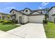 Beautiful two-story home with stone accents, well-manicured landscaping, and a two car garage at 3553 Secluded Ct, Sarasota, FL 34240