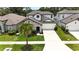 Charming home featuring a stone facade, well-maintained landscaping, and a spacious two-car garage at 3553 Secluded Ct, Sarasota, FL 34240