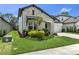 Inviting front yard showcasing lush landscaping, well-maintained lawn, and stunning stone accents on the facade at 3553 Secluded Ct, Sarasota, FL 34240