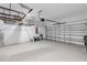 Spacious garage with shelving and ample room for storage and parking at 3553 Secluded Ct, Sarasota, FL 34240
