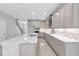 Bright kitchen with quartz countertops, stainless steel appliances, a designer backsplash, and an oversized island at 3553 Secluded Ct, Sarasota, FL 34240