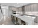 Modern kitchen with quartz countertops, tile backsplash, and stainless steel appliances at 3553 Secluded Ct, Sarasota, FL 34240