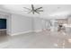 Large open living space with kitchen, staircase, and views to other rooms at 3553 Secluded Ct, Sarasota, FL 34240