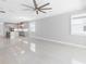 Spacious living area with ceiling fan and access to the kitchen at 3553 Secluded Ct, Sarasota, FL 34240