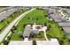 This aerial view showcases a beautiful playground and park with lush landscaping and neighborhood amenities at 3553 Secluded Ct, Sarasota, FL 34240