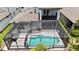 A screened-in pool area is the perfect spot for outdoor living and entertaining with ample space to relax at 3553 Secluded Ct, Sarasota, FL 34240