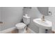 Bright powder room with modern fixtures and neutral color palette at 3553 Secluded Ct, Sarasota, FL 34240