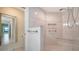 Bathroom features a tiled shower with a built-in bench at 3734 Ballantrae Dr # 19D, Sarasota, FL 34238