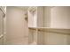 Walk-in closet with shelving and racks at 3734 Ballantrae Dr # 19D, Sarasota, FL 34238
