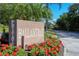 Private Ballantrae sign surrounded by flowers at 3734 Ballantrae Dr # 19D, Sarasota, FL 34238