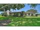 Charming home featuring mature landscaping and a lush green lawn, creating a welcoming and picturesque setting at 3734 Ballantrae Dr # 19D, Sarasota, FL 34238