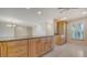 Spacious kitchen with granite countertops, light wood cabinets, and modern tile flooring at 3734 Ballantrae Dr # 19D, Sarasota, FL 34238