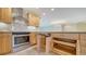 Kitchen with stainless steel oven, granite counters, and light wood cabinets with pull-out shelves at 3734 Ballantrae Dr # 19D, Sarasota, FL 34238