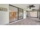 Enclosed lanai with tiled floor and ceiling fans at 3734 Ballantrae Dr # 19D, Sarasota, FL 34238