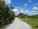 The Legacy Trail, a scenic recreational pathway, perfect for biking and walking amidst the beautiful Florida landscape at 3734 Ballantrae Dr # 19D, Sarasota, FL 34238