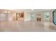 Open-concept living area with tile flooring leading into the kitchen at 3734 Ballantrae Dr # 19D, Sarasota, FL 34238