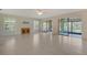 Open living room with tile floors, sliding glass doors and a ceiling fan at 3734 Ballantrae Dr # 19D, Sarasota, FL 34238