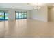 Spacious living room with ceramic tile flooring, large windows, and ample natural light, perfect for entertaining at 3734 Ballantrae Dr # 19D, Sarasota, FL 34238