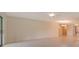 Bright living area with sliding doors, tile floors, and neutral wall color at 3734 Ballantrae Dr # 19D, Sarasota, FL 34238