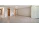 Spacious main bedroom with tile floors, walk-in closet, and ensuite bathroom at 3734 Ballantrae Dr # 19D, Sarasota, FL 34238