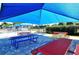 A colorful and shaded picnic area, creating a perfect spot for residents to relax and enjoy outdoor meals at 3734 Ballantrae Dr # 19D, Sarasota, FL 34238