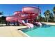 Resort-style community pool featuring a water slide, providing endless fun for residents and families at 3734 Ballantrae Dr # 19D, Sarasota, FL 34238