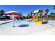 Resort-style community pool featuring a splash area with a water slide, providing endless fun for residents and families at 3734 Ballantrae Dr # 19D, Sarasota, FL 34238