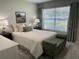 Cozy bedroom with a queen bed, neutral tones, and large window at 3703 39Th Street W # 11, Bradenton, FL 34205