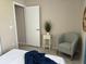 Cozy bedroom with a chair and a nice table next to it at 3703 39Th Street W # 11, Bradenton, FL 34205