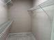 Open walk-in closet with neutral walls and wire shelving at 3703 39Th Street W # 11, Bradenton, FL 34205