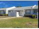 Charming single-story home featuring a well-maintained lawn and cozy front porch at 3703 39Th Street W # 11, Bradenton, FL 34205