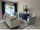 Bright living room showcasing a comfortable seating arrangement and stylish accent furniture at 3703 39Th Street W # 11, Bradenton, FL 34205