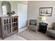 Comfortable sitting area with artwork, cabinet and natural light at 3703 39Th Street W # 11, Bradenton, FL 34205